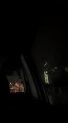Rainy night drive captured from Mexico City vehicle interior