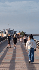 Casual waterfront dining and strolling observed in Dénia marina