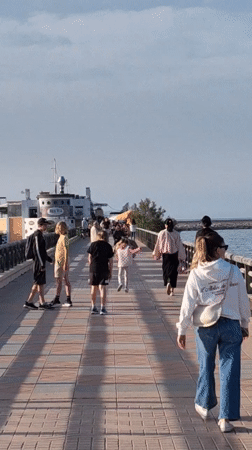 Casual waterfront dining and strolling observed in Dénia marina