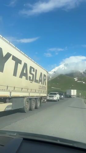 Turquoise truck spotted on mountain road in Gudauri, Georgia