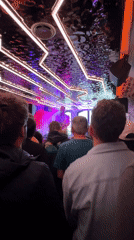 Saxophonist performs at Brighton venue under purple lights