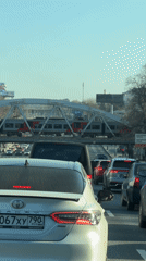 Traffic jam observed in Moscow on sunny afternoon