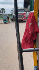 Auto-rickshaw ride through busy Rafin Par streets, Nigeria