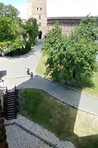 Tourist documents historic castle visit in Lutsk, Ukraine