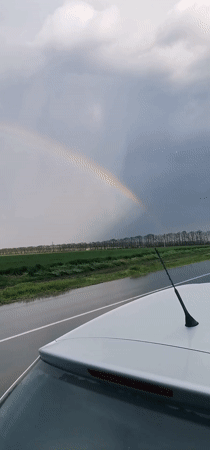Rainbow appears over rural Bulgaria after rain showers
