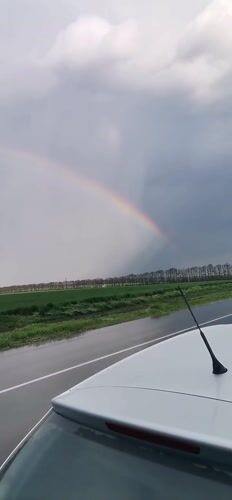 Rainbow appears over rural Bulgaria after rain showers