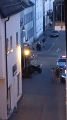 Police stop on a Winnenden cobblestone street, evening