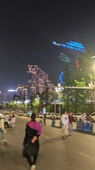 Nighttime crowds gather across central Chongqing public spaces