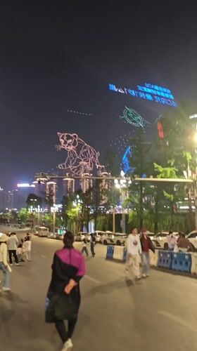 Nighttime crowds gather across central Chongqing public spaces