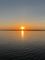 Sunset over water documented in Chaikovsky, Russia