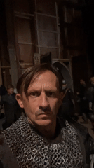 Costumed man in chainmail takes selfie in Mumbai