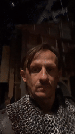 Costumed man in chainmail takes selfie in Mumbai
