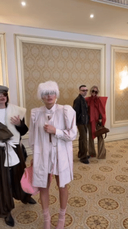 Fashion show held in ornate Kyiv hall showcases designer dresses