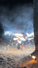 Fire performers stage nighttime beach show in Kamala Thailand