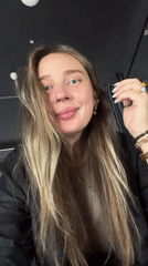 Woman takes selfies in Moscow wearing jewelry and accessories