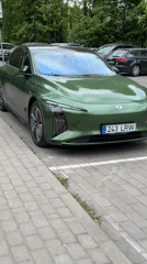 Green electric car and cyclist spotted in Tallinn