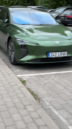 Green electric car and cyclist spotted in Tallinn