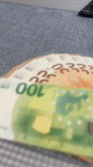 Euro banknotes observed on table surface in Munich