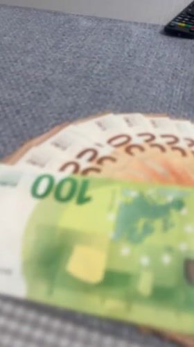 Euro banknotes observed on table surface in Munich
