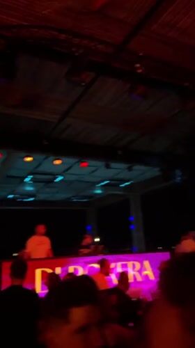 Nightclub scene in Burgas, DJ booth and social crowd