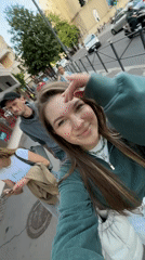 Woman records cheerful selfie video on sunny day in Belgrade