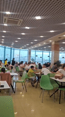 Food court busy with diners and restaurant queues