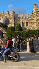 Formal gathering at medieval stone building in Arbanassi, Bulgaria