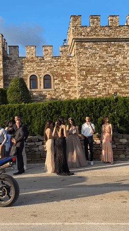 Formal gathering at medieval stone building in Arbanassi, Bulgaria