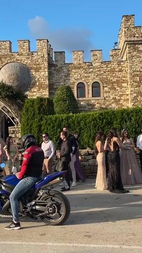 Formal gathering at medieval stone building in Arbanassi, Bulgaria