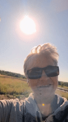 Sunny day out: selfies, purple flowers, and reaching for the sun
