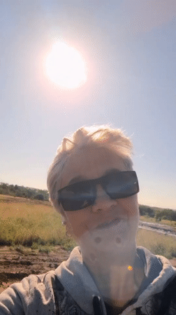 Sunny day out: selfies, purple flowers, and reaching for the sun