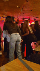 Women dine and dance at Mexican restaurant in Portugal