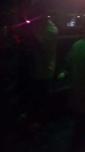 People gather in dimly lit space in Lokoja, Nigeria