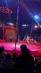 Circus performer balances on unicycle in Chernogolovka tent show