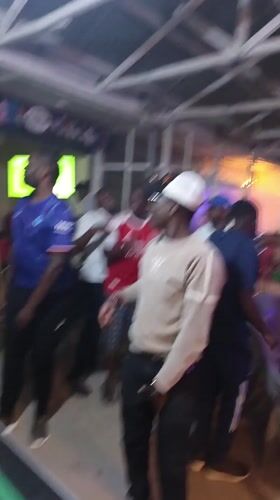 Evening social gathering captured at Nairobi bar with pool