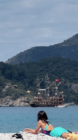 Child watches Turkish pirate ship from Fethiye beach