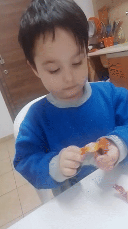 Children observed in kitchen scene in Lemesos, Cyprus