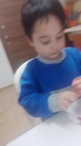 Children observed in kitchen scene in Lemesos, Cyprus