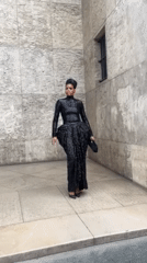 Woman in black dress photographed at Paris landmarks Sunday