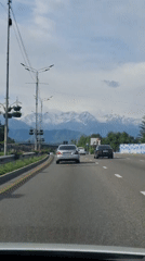 Dash camera captures routine traffic on Almaty roadway