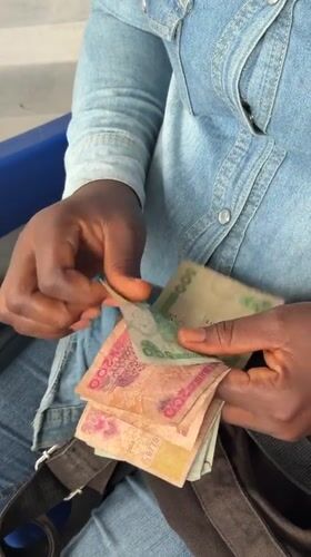Counting Naira notes in Ado, Nigeria