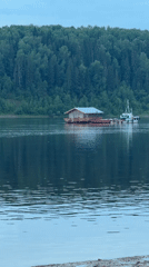 Ferry boats and floating homes on Volga River