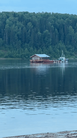 Ferry boats and floating homes on Volga River