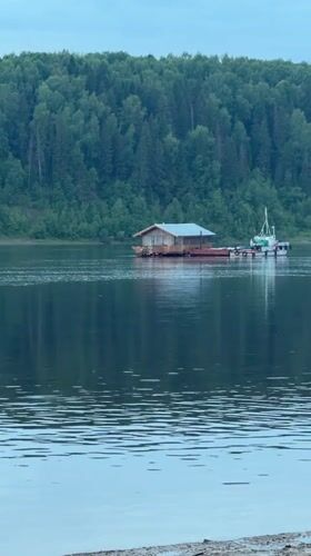 Ferry boats and floating homes on Volga River