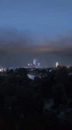Storm clouds gather over Belgrade skyline at dusk