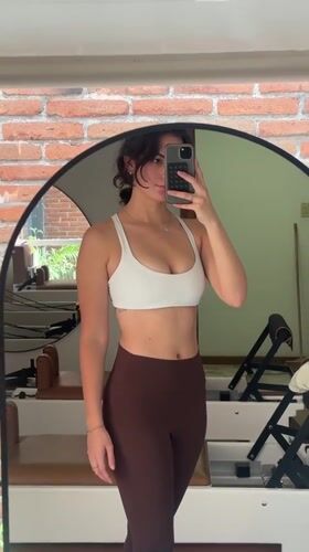 Woman takes mirror selfie in Puebla room