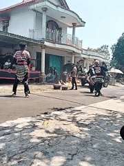 Traditional cultural performance outdoors in Kerjo, Indonesia