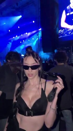 Masked DJ performs outdoor nighttime concert in Belgrade suburb