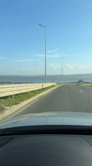 Driver records curved road with guardrail in Burgas, Bulgaria