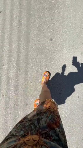 Person in colorful sandals walks paved street in Chania